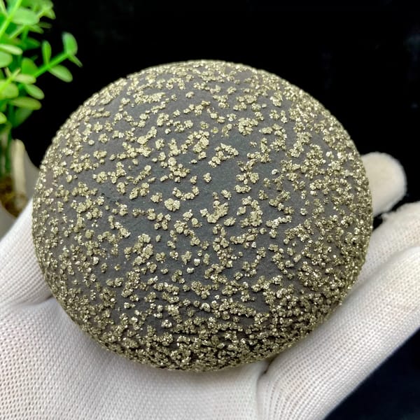 Iron concretion sphere dusted with pyrite from Yunnan, China, detail of the matrix contact