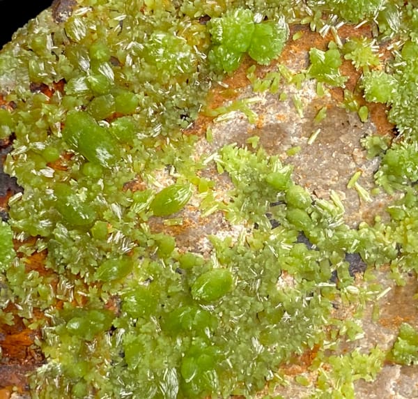 Lime-green botryoidal pyromorphite over rusty plate from Gongcheng, Guangxi, China, side view