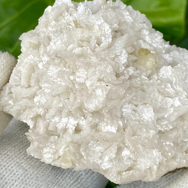 White dolomite plate with small pale calcite crystal from Guizhou, China, second angle