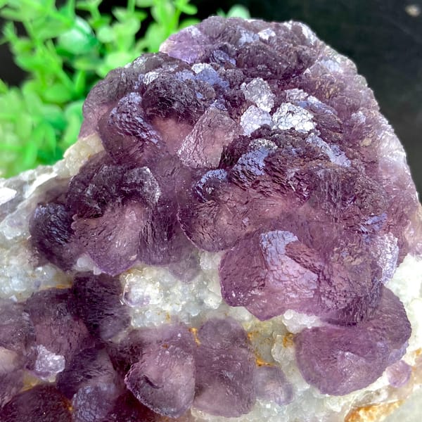 Dome of lavender botryoidal fluorite over quartz from Zhejiang, China, side view