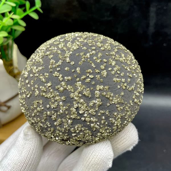 Dark iron concretion ball speckled with pyrite grains from Yunnan, China, second angle