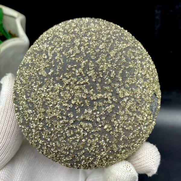 Iron concretion sphere speckled with pyrite from Yunnan, China, reverse side