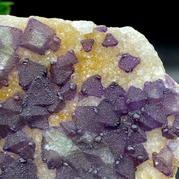 Plate of purple fluorite octahedra on white quartz from Zhejiang, China, side view
