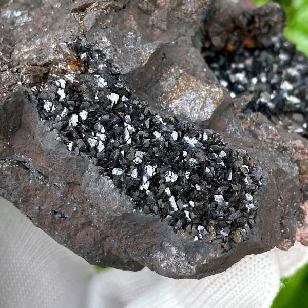 Mass of platy black hematite from Yunnan, China, close-up of the crystal faces