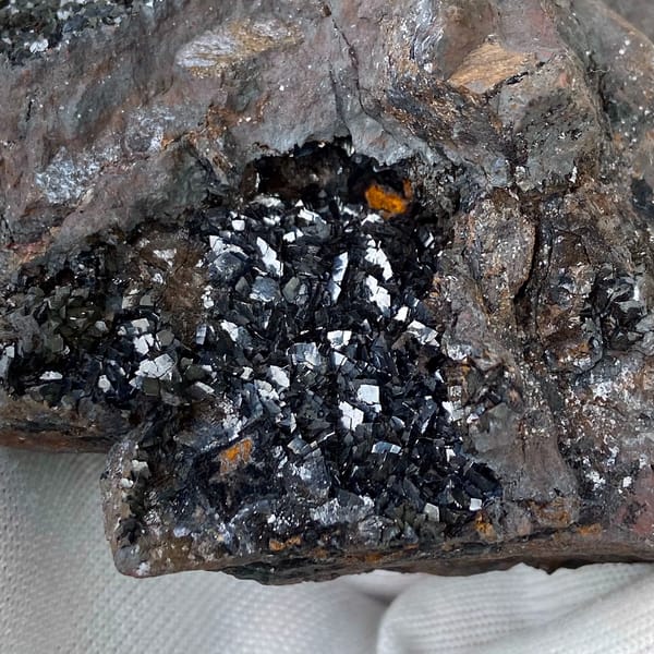 Mass of platy black hematite from Yunnan, China, close-up of terminations