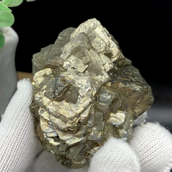 Stepped pyrite crystal stack with pale metallic sheen from Yunnan, China, close-up of the crystal faces