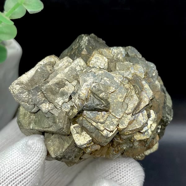 Stepped pyrite crystal stack with pale metallic sheen from Yunnan, China, detail of the matrix contact