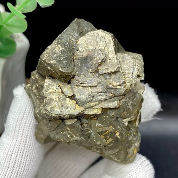 Stepped pyrite crystal stack with pale metallic sheen from Yunnan, China, close-up of terminations