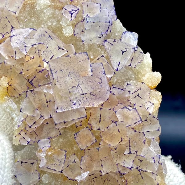 Tall plate of transparent purple-edged fluorite cubes from Guizhou, China, reverse side