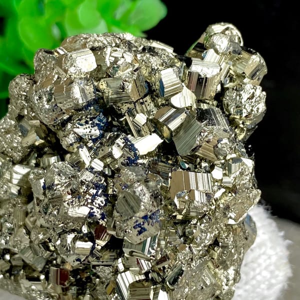Rounded cluster of bright pyrite dodecahedra from Peru, reverse side