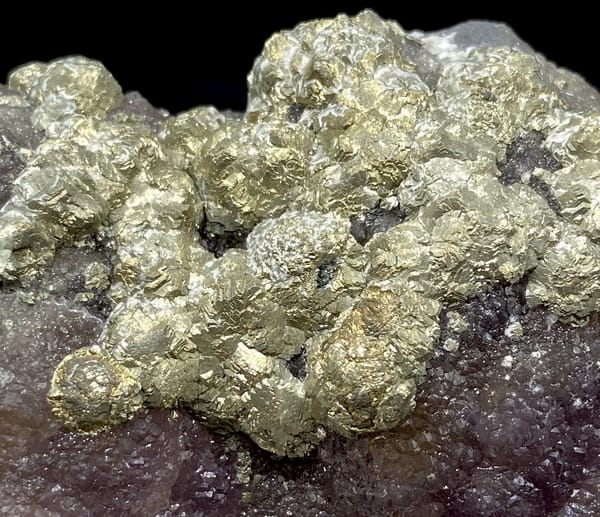 Pale pyrite rosettes over plum-purple fluorite from Jiangxi, China, overall view