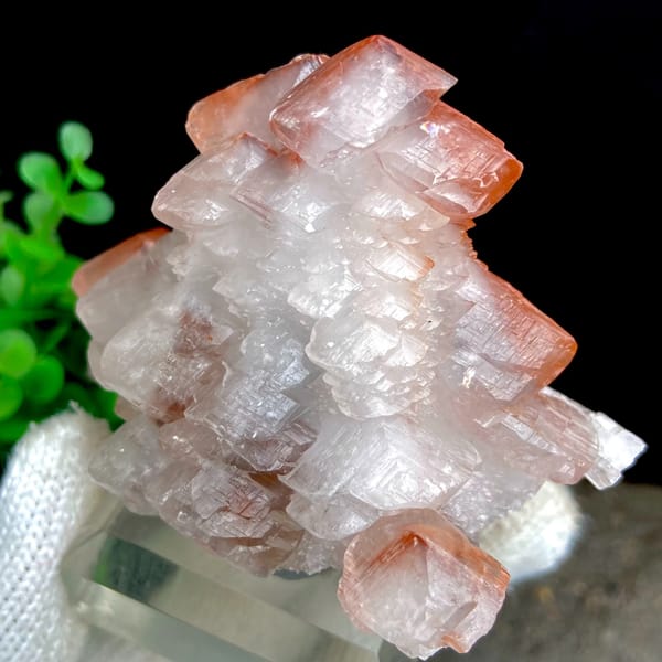 Stacked pagoda calcite with orange-red caps from Hubei, China, close-up of the crystal faces