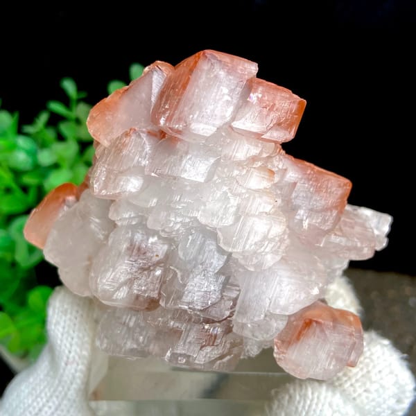 Stacked pagoda calcite with orange-red caps from Hubei, China, detail of the matrix contact