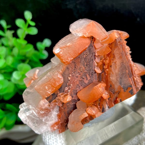 Stacked pagoda calcite with orange-red caps from Hubei, China, close-up of terminations