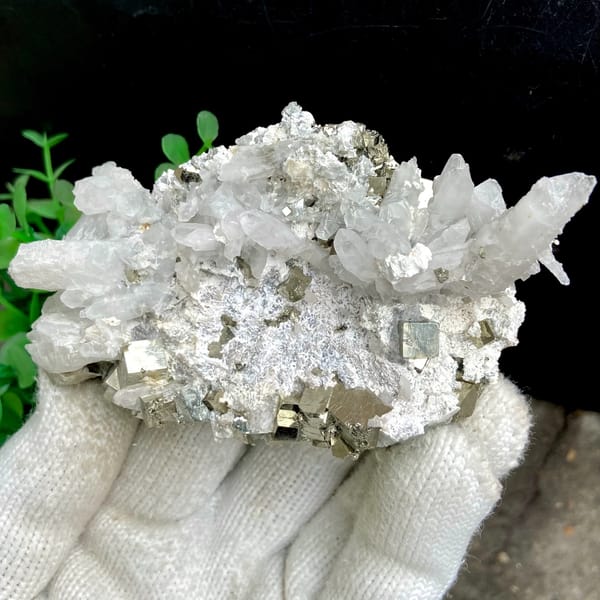 White quartz needles fanning over pyrite-studded base from Shangbao, Hunan, China, second angle