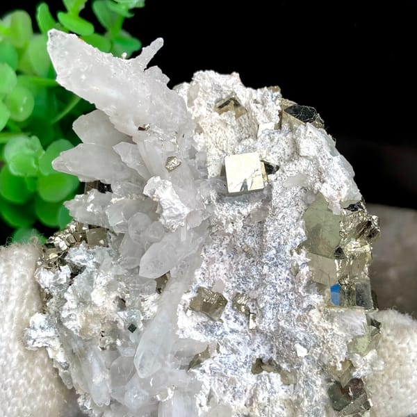 White quartz needles fanning over pyrite-studded base from Shangbao, Hunan, China, reverse side