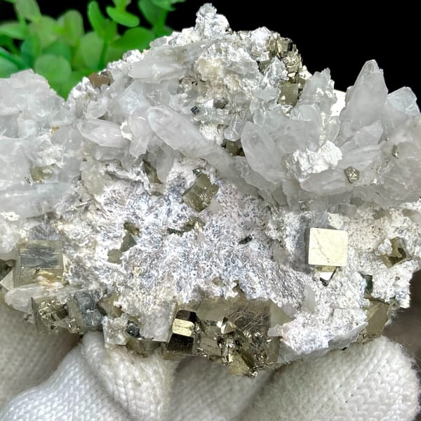 White quartz needles fanning over pyrite-studded base from Shangbao, Hunan, China, top view