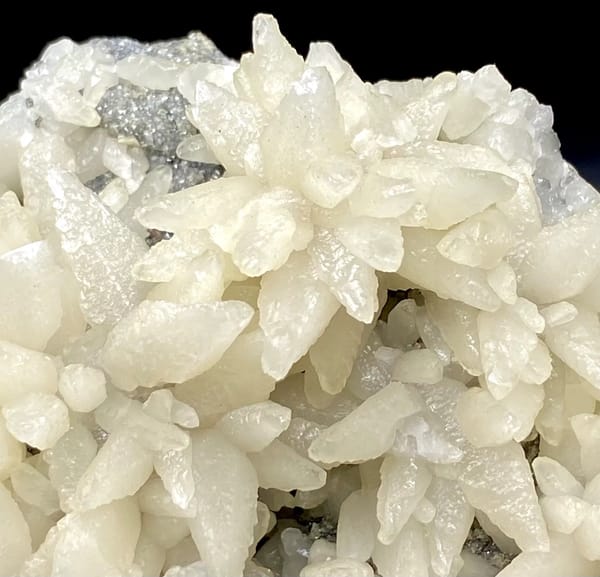 Dome of white flower-form calcite points from Guizhou, China, reverse side