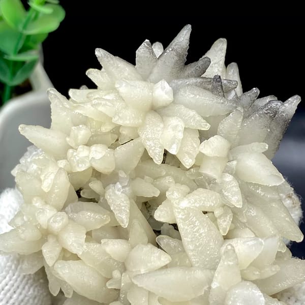 Dome of white flower-form calcite points from Guizhou, China, close-up of terminations