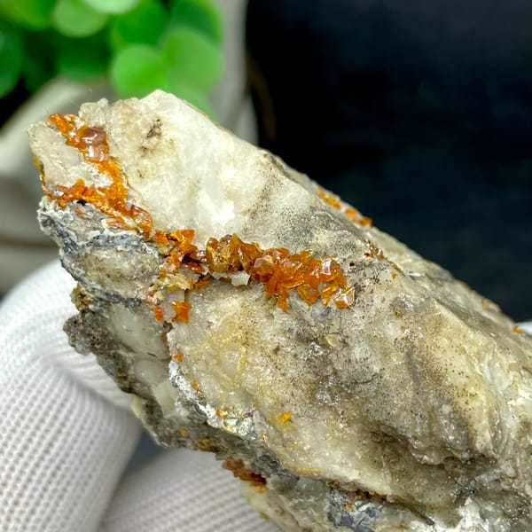 Tall white matrix wedge with orange-red wulfenite from Sichuan, China, detail of the matrix contact