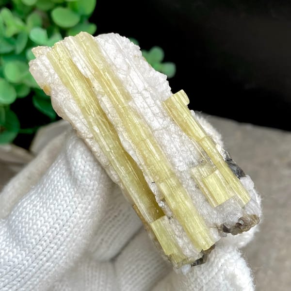 Tall golden topaz column with white matrix from Germany, close-up of terminations