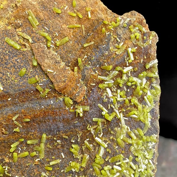 Plate of rusty matrix sprinkled with green pyromorphite needles from Wuzhou, Guangxi, China, reverse side