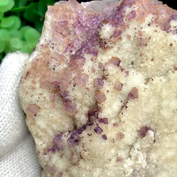 Purple fluorite cubes over white quartz plate from Guizhou, China, close-up of terminations