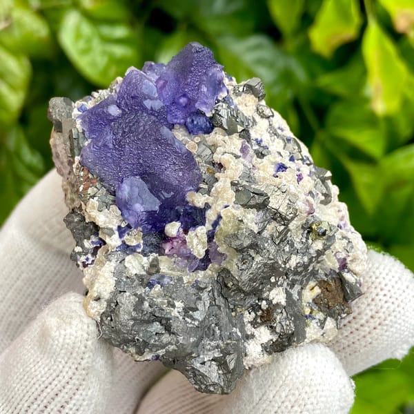 Vivid purple fluorite octahedron on grey arsenopyrite from Inner Mongolia, China, top view