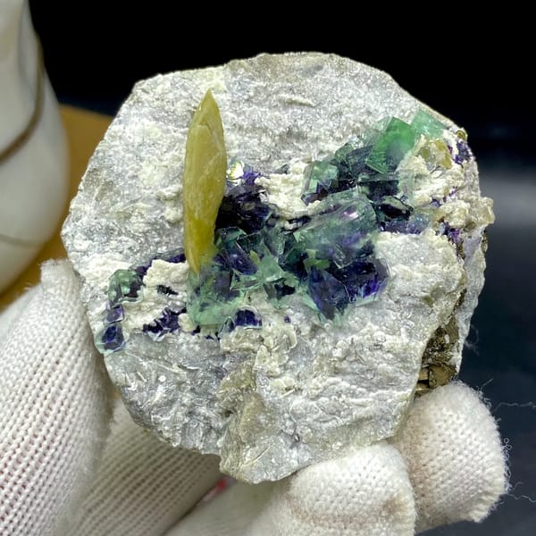 Purple-cored green fluorite cubes with yellow siderite blade from Inner Mongolia, China, close-up of the crystal faces