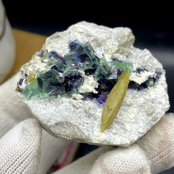 Purple-cored green fluorite cubes with yellow siderite blade from Inner Mongolia, China, reverse side