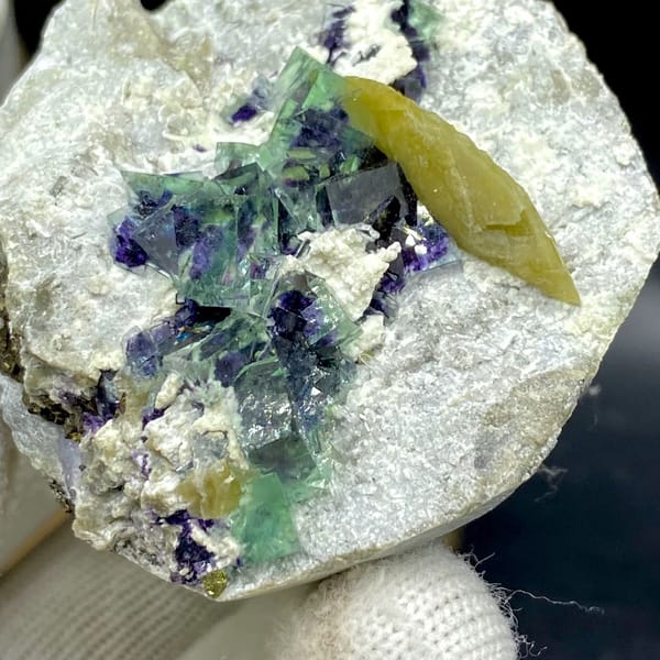 Purple-cored green fluorite cubes with yellow siderite blade from Inner Mongolia, China, top view