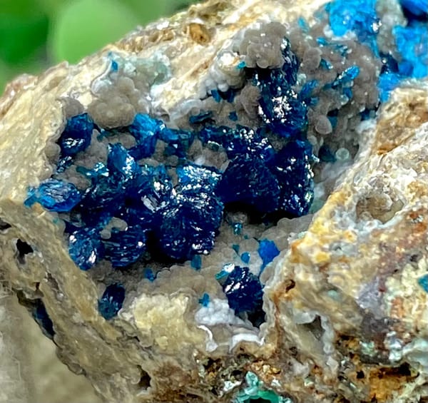 Deep blue veszelyite crystals in pale pocket from Yunnan, China, side view