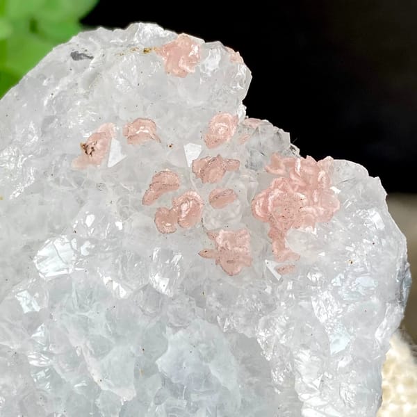 Pink rhodochrosite dots on white quartz block from Guangxi, China, top view