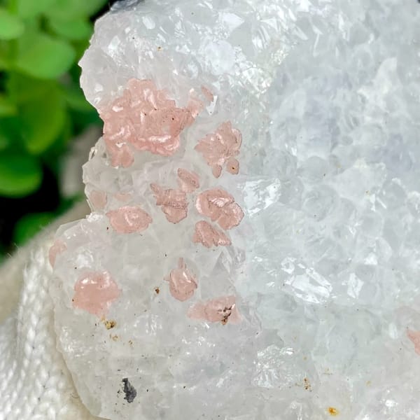Pink rhodochrosite dots on white quartz block from Guangxi, China, side view
