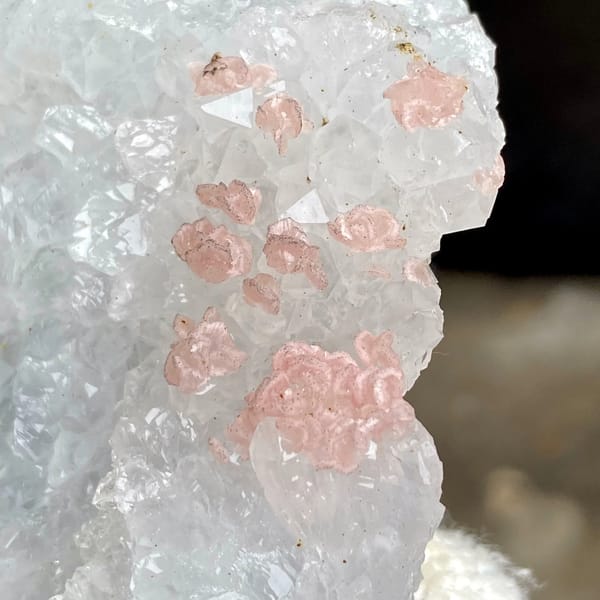 Pink rhodochrosite dots on white quartz block from Guangxi, China, overall view