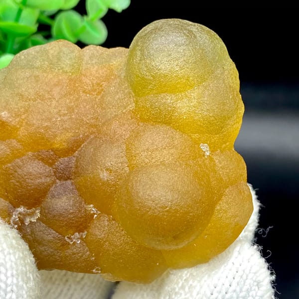Honey-yellow botryoidal fluorite mass from Henan, China, close-up of terminations