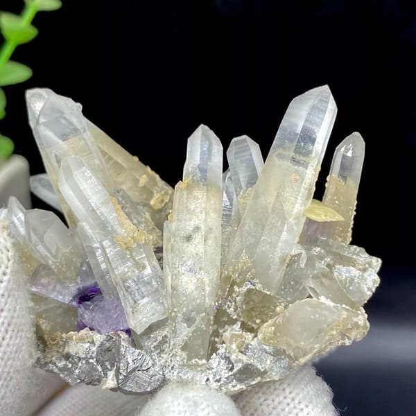 Clear quartz prisms with purple fluorite cube and siderite from Yaogangxian, Hunan, China, close-up of the crystal faces