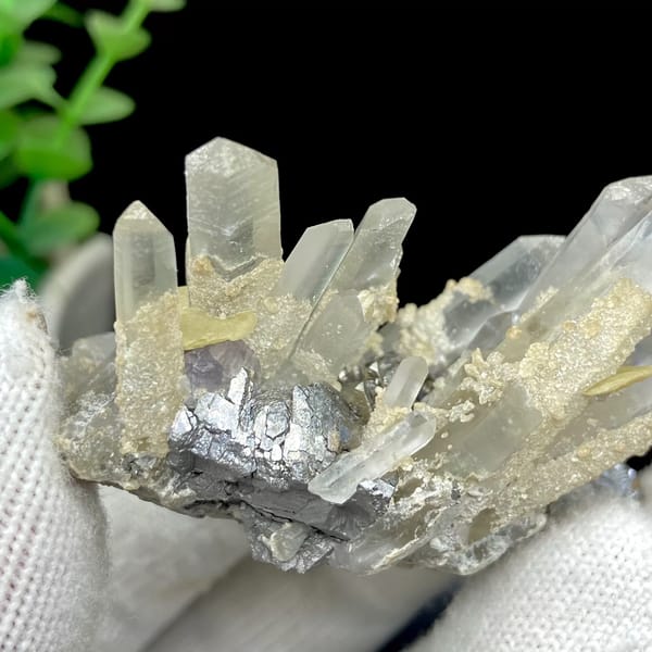 Clear quartz prisms with purple fluorite cube and siderite from Yaogangxian, Hunan, China, detail of the matrix contact