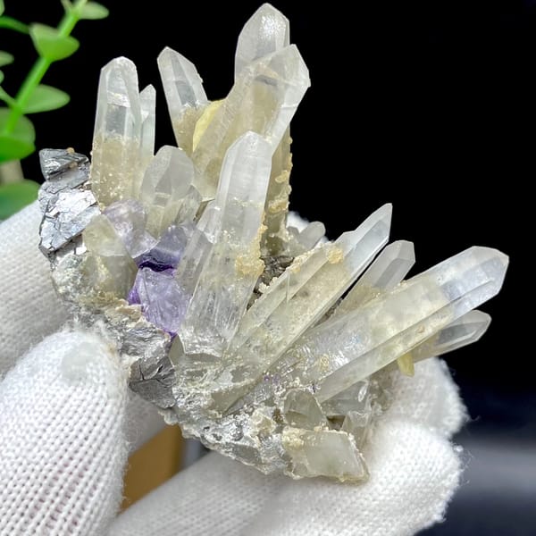 Clear quartz prisms with purple fluorite cube and siderite from Yaogangxian, Hunan, China, side view