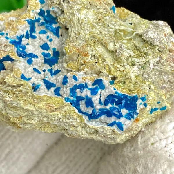 Electric-blue platy veszelyite on tan matrix from Yunnan, China, side view