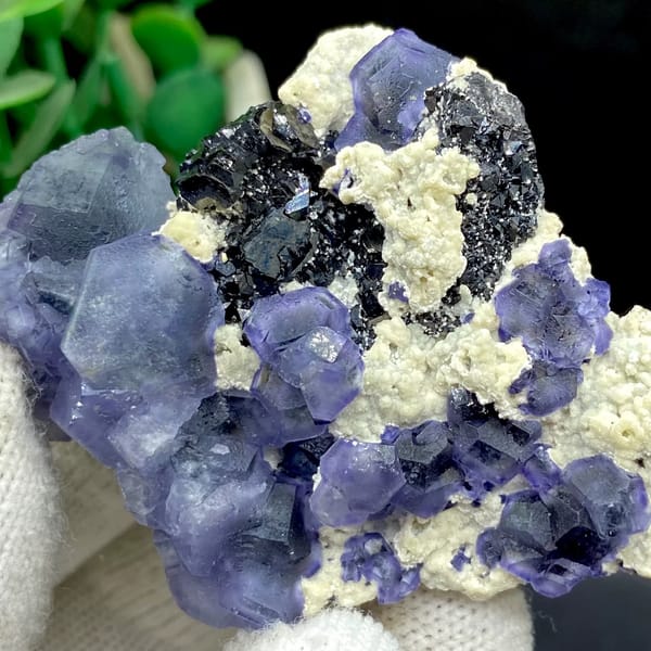 Frosted lavender phantom fluorite with black crystals and cream druse from Inner Mongolia, China, top view