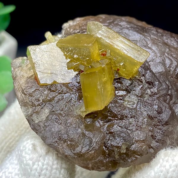 Golden baryte blades on smooth brown fluorite ball from Jiangxi, China, top view