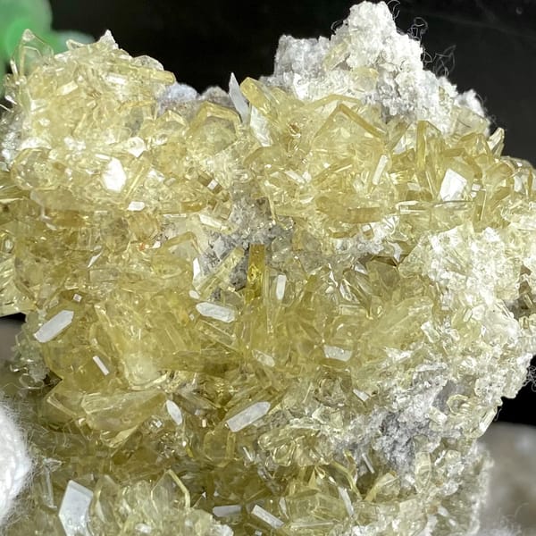 Cluster of pale golden transparent baryte blades from Yunnan, China, side view
