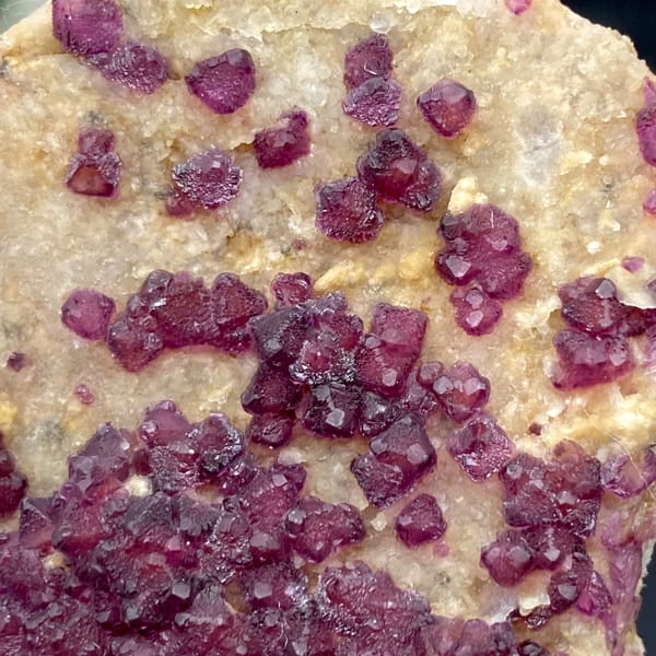 Purple-red fluorite octahedra on pale matrix from Henan, China, side view