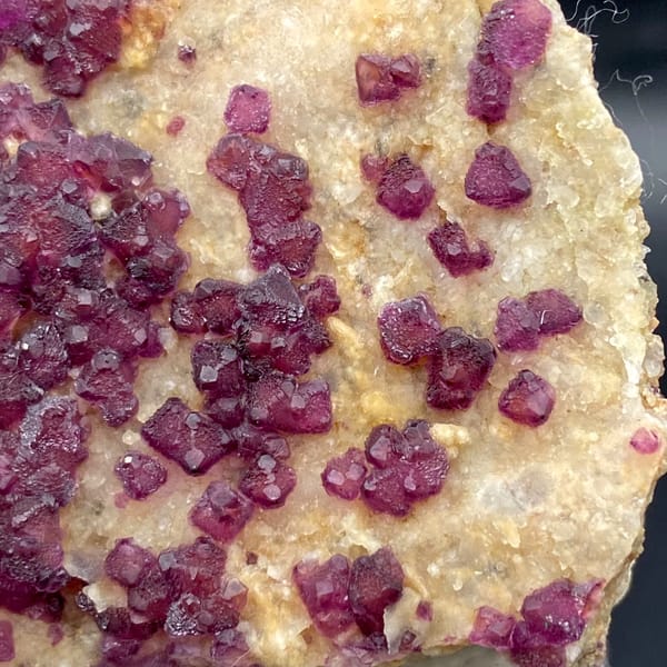 Purple-red fluorite octahedra on pale matrix from Henan, China, overall view