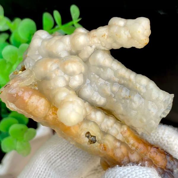 Three tube-shaped agate stalactites in grey and caramel from Indonesia, top view