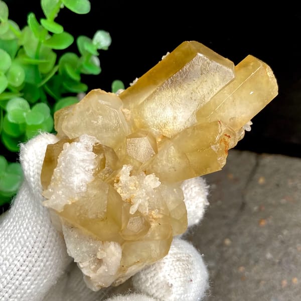 Honey-yellow hexagonal calcite prisms with quartz from Shangbao, Hunan, China, close-up of the crystal faces