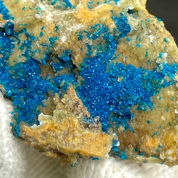 Tall plate of blue-green veszelyite crystals from Yunnan, China, close-up of the crystal faces