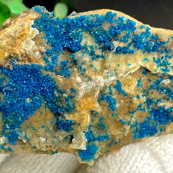 Tall plate of blue-green veszelyite crystals from Yunnan, China, detail of the matrix contact