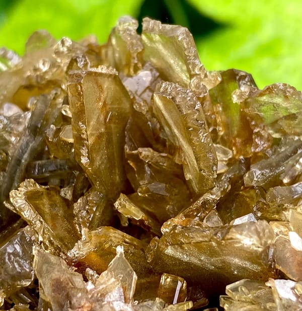 Rounded cluster of amber transparent baryte blades from Yunnan, China, second angle